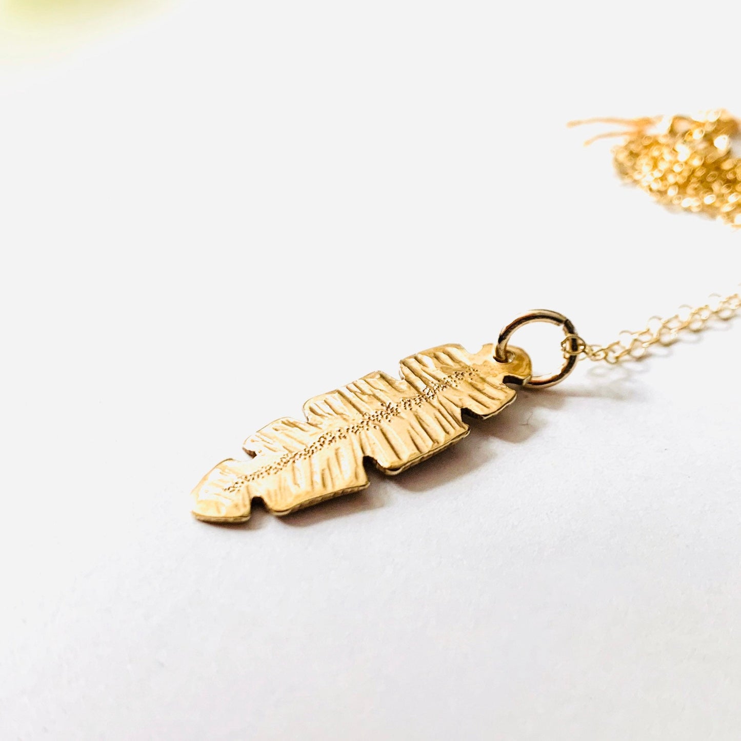 Gold and Brass Banana Leaf Pendant Necklace by Maribelle Campa