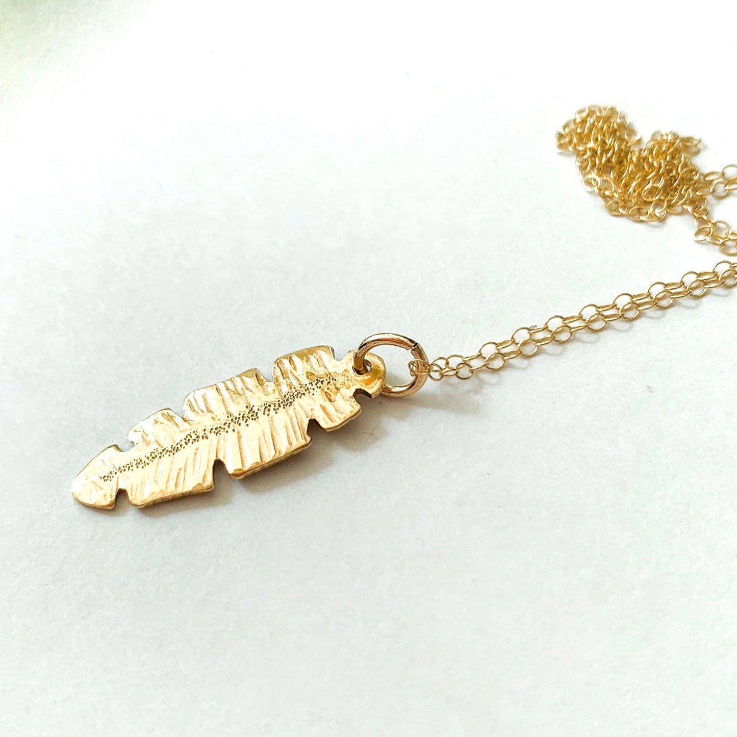 Gold and Brass Banana Leaf Pendant Necklace by Maribelle Campa