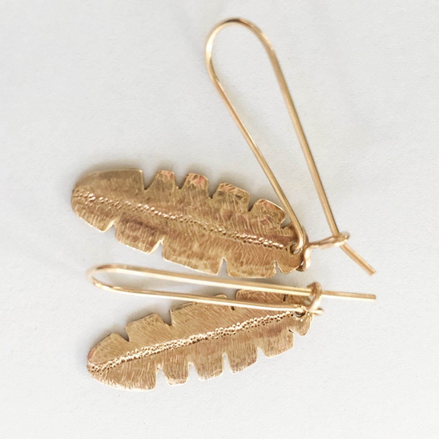 Gold and Brass Banana Leaf Earrings by Maribelle Campa